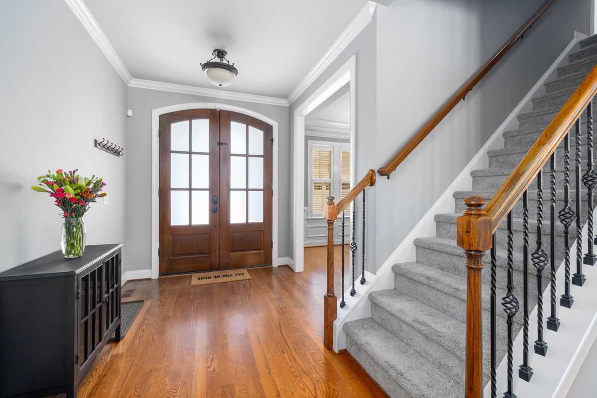 Beautiful home foyer with staircase and entryway decor