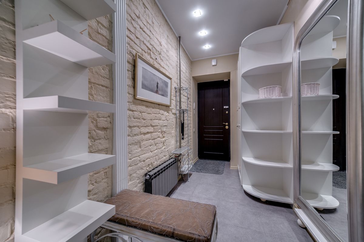 Minimal modern entryway with compact console and shelving