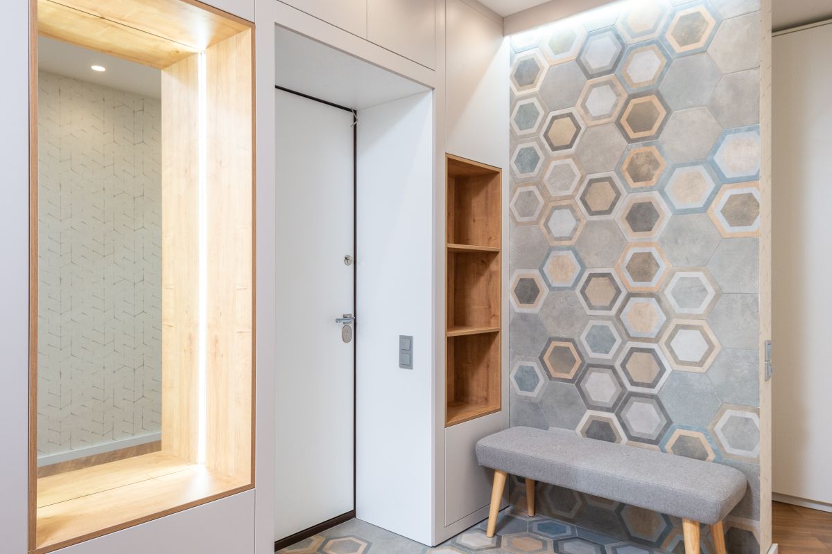 Modern hallway with bench mirror shelves and wall decor